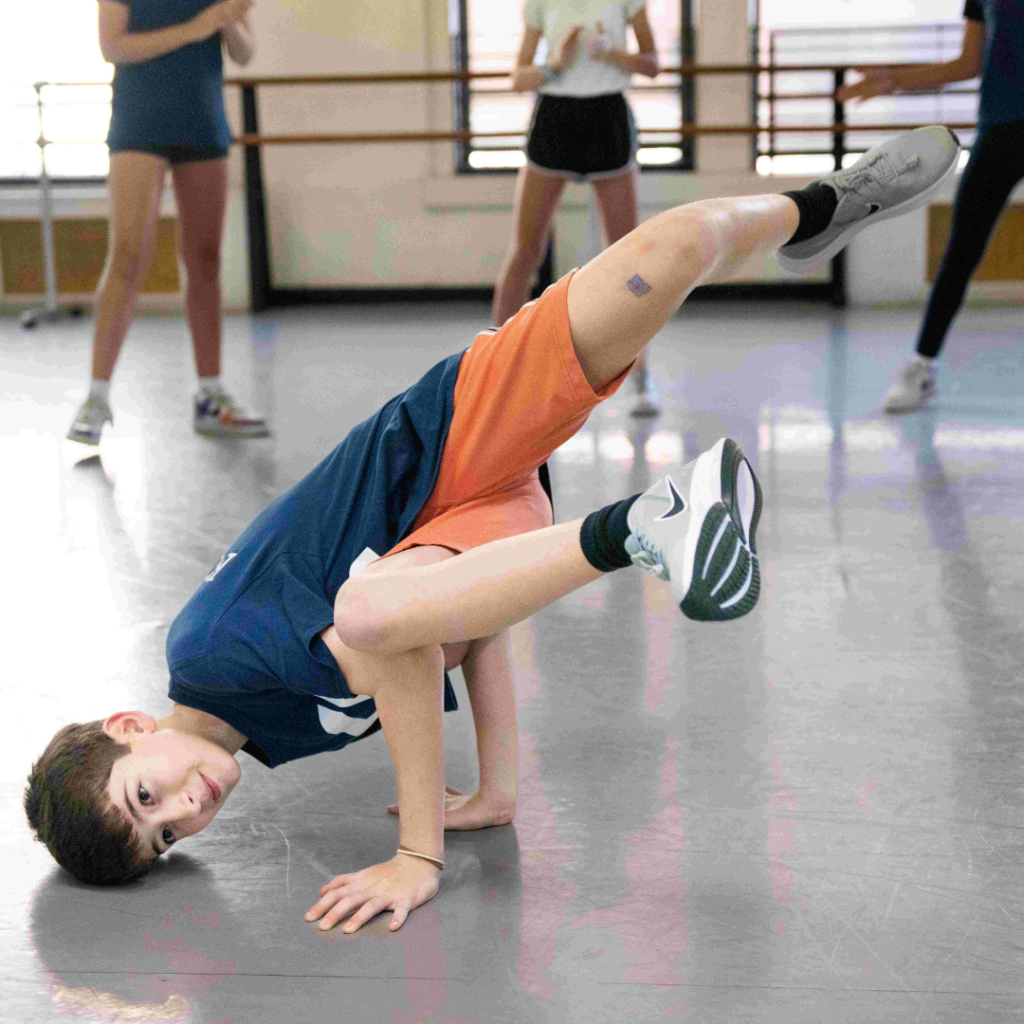 Steps academy dancer learning hip hop - spinning break dance style on his head