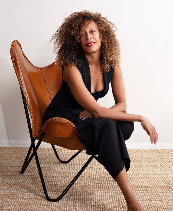 STEFANIE BATTEN BLAND sitting in a chair