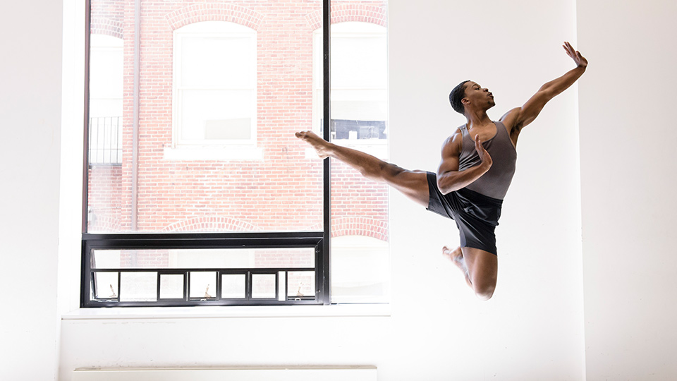 Boston Conservatory dance student leaping.